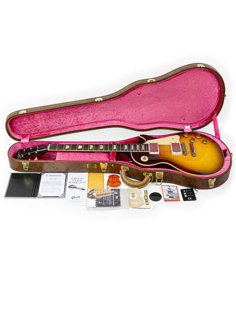 A closed guitar case reveals a Gibson Custom Shop 60th Anniversary 1960 Les Paul Standard R/I along with its accessories.