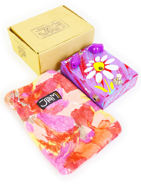 A decorative box adorned with a flower, topped with another flower, showcasing the JAM Pedals RetroVibe mk.2 from Greece.