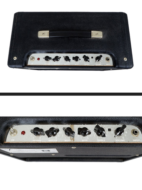 A guitar amplifier with control knobs for reverb, master, middle, bass, treble, and volume.