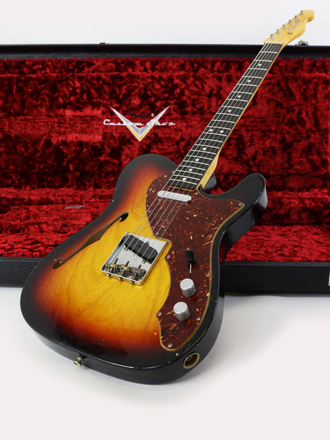A guitar and its case featuring a Fender Limited Edition ’60s Telecaster Thinline, showcasing a blend of style and heritage.

