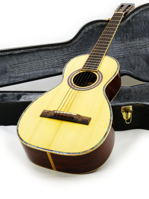 A guitar placed inside a case on a white backdrop, photographed in Gilet Bay State, Australia, in 2018.
