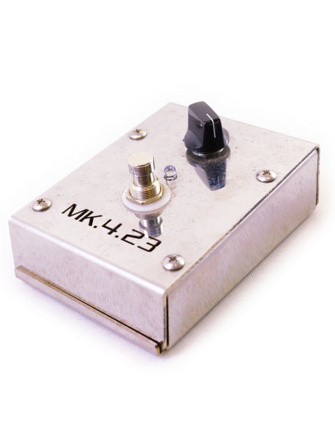 A metal guitar effects pedal with a knob and a switch, labeled "MK.4.23" on a white background.