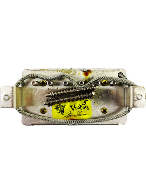 A metal pickup featuring a yellow sticker, identified as Peter Florance Voodoo Humbucker ’59 Bridge Pickup - USA 2005.