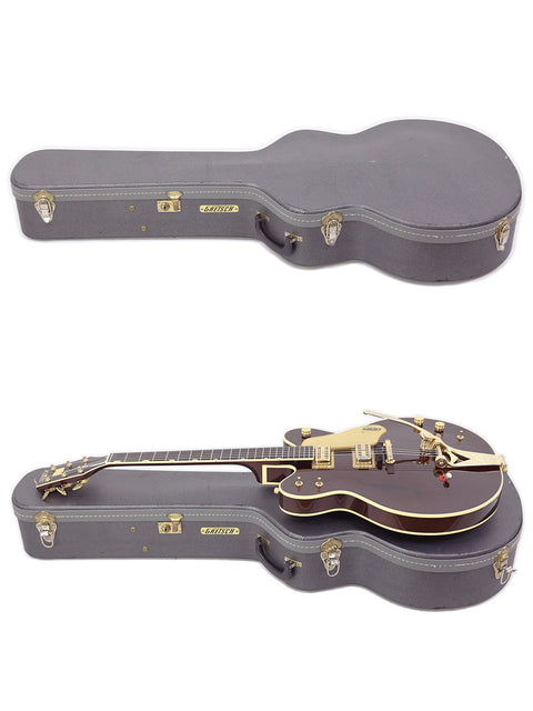 A pair of Gretsch 6122T Chet Atkins guitars in a stylish black case, ideal for guitar enthusiasts and collectors alike.