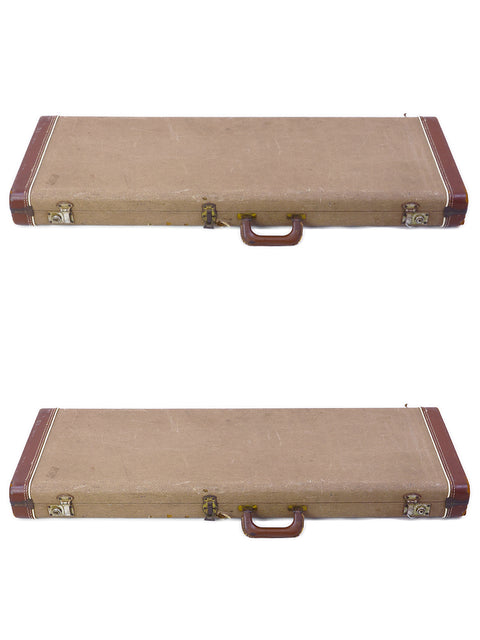 A pair of brown suitcases with handles on each side, exuding a vintage travel vibe.