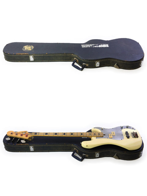 A pair of guitars with cases displayed on a white surface, including a 1978 Ibanez Silver Series P/J Bass from Japan.