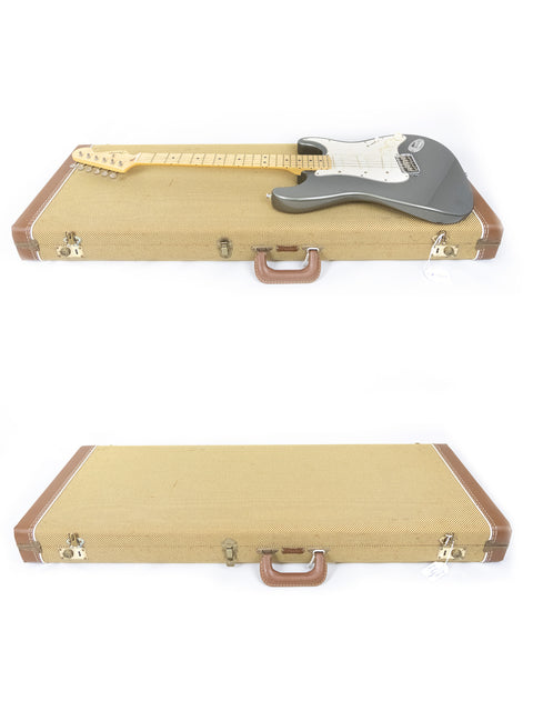  A protective hard case for a 1988 Fender Eric Clapton Signature Series Stratocaster, emphasizing its custom shop quality.
