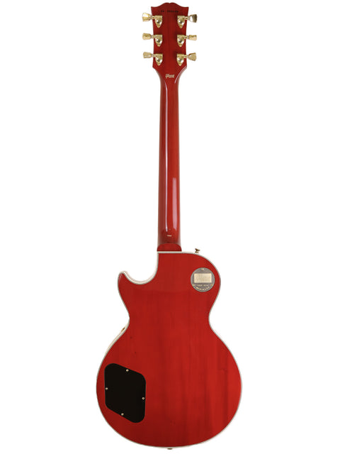 A red Gibson Custom Shop Les Paul Custom electric guitar against a clean white background, showcasing its sleek design.
