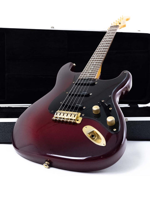 A red Levinson Blade R2 electric guitar from Japan, 1989, resting in its case, ready for performance.
