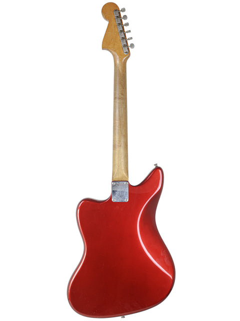 A red electric guitar with a wooden body, featuring the vintage L-Series Fender Jaguar model, refinished from 1964.