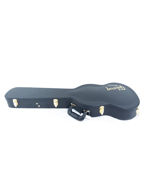 A sleek black guitar case set against a white background, showcasing the Gibson Custom ’61 Les Paul SG Standard, USA 2020.