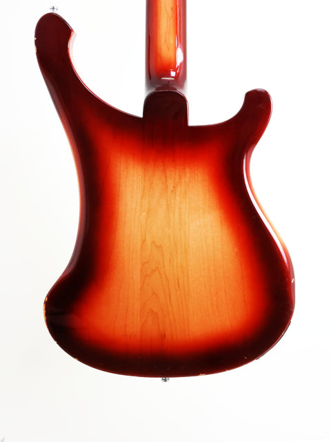 A striking red Rickenbacker 4003 Fireglo Bass guitar, featuring a bold body and neck, made in the USA in 1997.