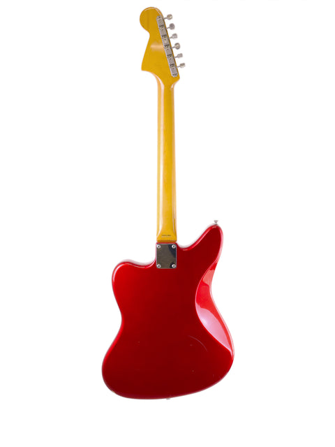 A striking red guitar featuring a yellow neck, identified as a Fender CIJ Jaguar from Japan, produced between 1999 and 2002.