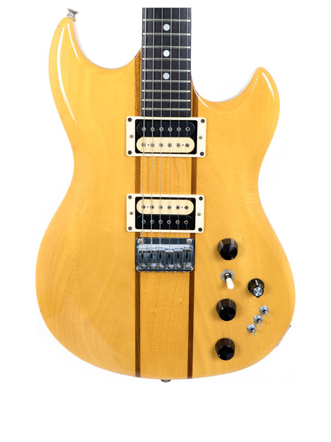 A striking yellow electric guitar with a stylish black pickguard, representing the Aria Pro II TS 400 Tri Sound Series from 1980.