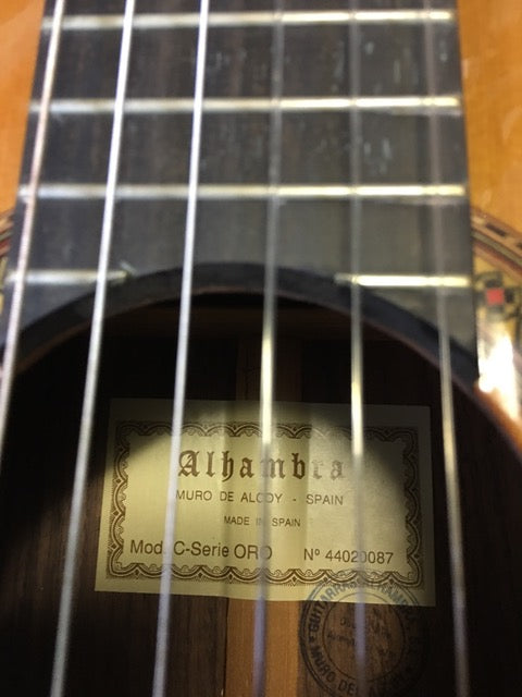 A stunning Alhambra C-Series ORO Classical Guitar, crafted in Spain in 2005, featuring exquisite details and rich tones.
