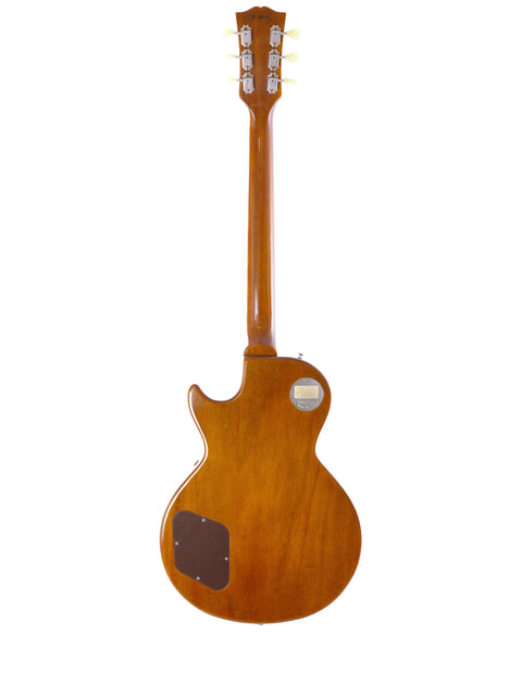 A stunning Gibson Custom Historic VOS LPR-6 1956 Reissue Gold Top guitar featuring a wooden body and neck.