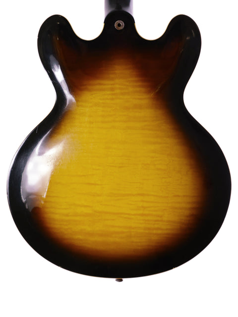 A stunning Gibson ES-335 guitar featuring a sunburst finish, highlighting its classic style and quality from Nashville, USA, 2006.
