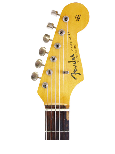 A stunning yellow 1964 Fender Stratocaster, part of the L Series, showcasing its vintage charm and iconic style.