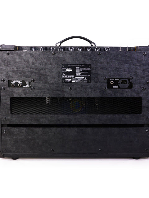 A stylish black guitar amplifier, the Vox AC15 C1X, on a plain white background.