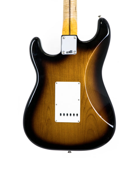 A sunburst electric guitar body against a white background.
