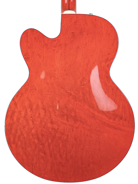 A vibrant orange guitar with a white body and neck, the Gretsch 6120DE Duane Eddy Signature model from Japan, 1997.