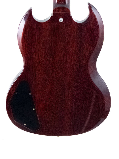 A vibrant red Gibson Custom ’61 Les Paul SG Standard guitar with a stylish black pickguard, highlighting its iconic look.