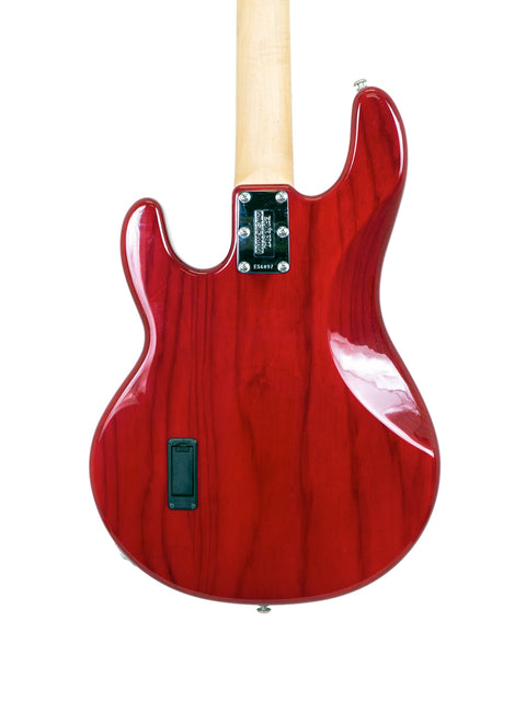 A vibrant red electric guitar with a wooden body, representing the USA-made Music Man Stingray 4 H Bass from 2008.