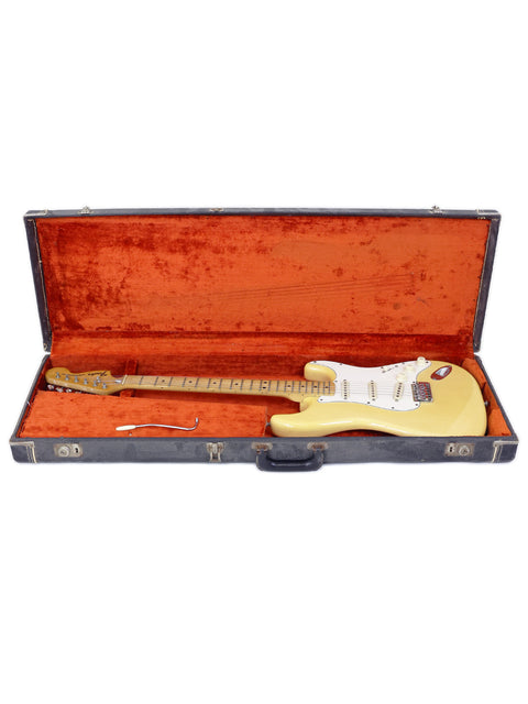 A vintage 1962 Fender Stratocaster in cream color, featuring a white pickguard, representing iconic American guitar design.
