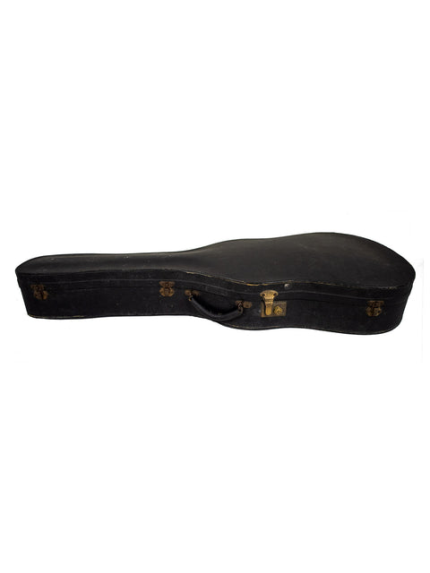 A vintage 1962 Gibson LG-3 Acoustic guitar case, covered in black leather, representing classic musical heritage.