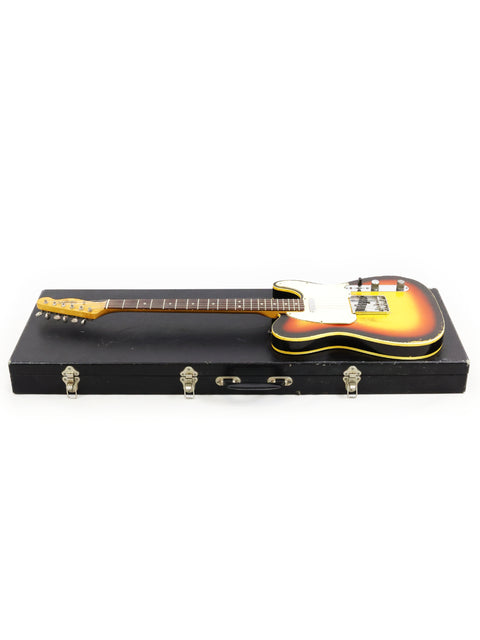 A vintage 1966 Fender Custom Telecaster guitar in its case, elegantly presented on a white surface.