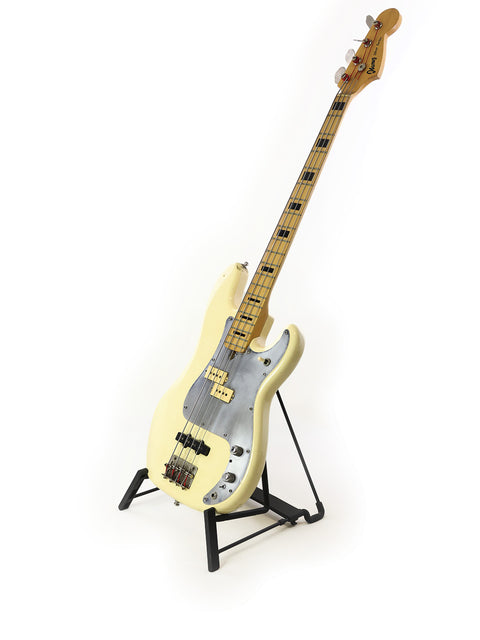 A vintage 1978 Ibanez Silver Series P/J bass guitar in white, elegantly positioned on a stand, highlighting its classic appeal.