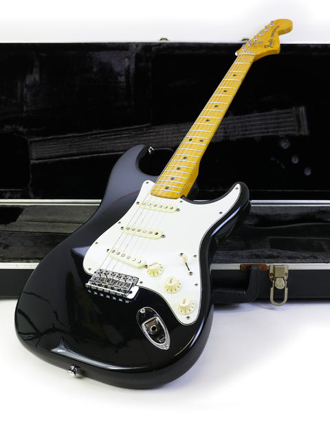 A vintage 1981 Fender Stratocaster electric guitar rests in a black case, embodying the essence of rock and roll history.