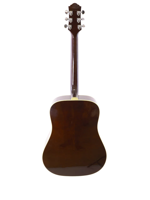 A vintage 1989 Guild D40 acoustic guitar in brown, set on a stark white background.