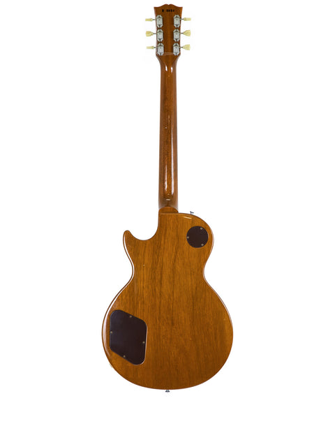 A vintage Gibson Les Paul guitar featuring a wooden body and neck, part of the 1993 Pre-Historic reissue series.