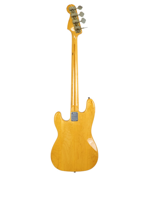 A vintage Greco PB 750 bass guitar featuring a wooden body, made in Japan from 1971 to 1975, highlighting its craftsmanship.