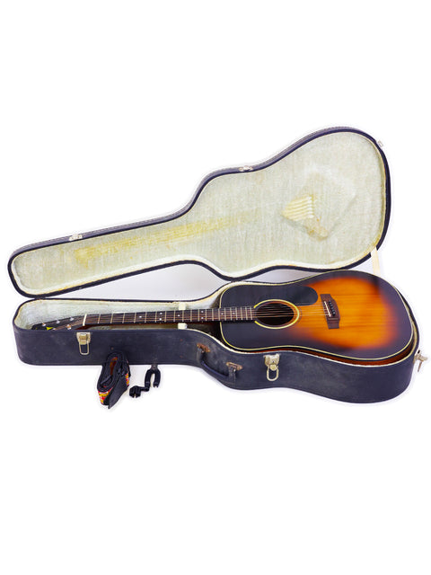 A vintage K. Yairi W1S acoustic guitar from Japan 1983 rests inside a protective guitar case.