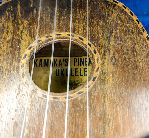 A vintage Kamaka Pineapple Ukulele from Hawaii, crafted in 1930, highlighting its iconic design and musical heritage.