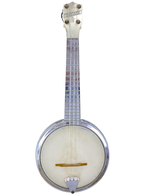 A vintage banjo with "DIXIE" inscribed on the headstock, isolated on a white background.