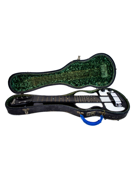 A vintage guitar case reveals a green and black Rickenbacher Electro Lap Steel guitar from the 1930s.