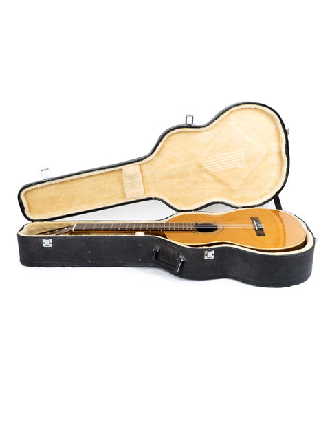 A vintage wooden guitar case for Vicente Sanchis Model 34 Classical, made in Spain in 1979, on a white surface.