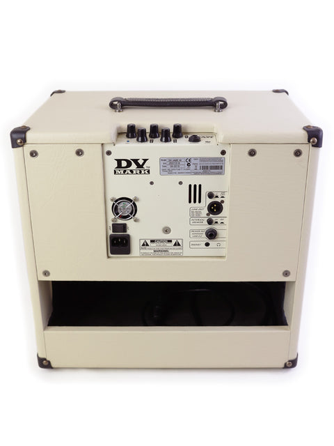 A white DV Mark Jazz 12 Combo amplifier, elegantly covered in black, designed for high-quality sound and performance at 80 watts.