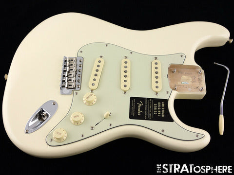  A white Fender '60s Strat Partscaster guitar with a pickup and cover, highlighting its Custom Shop design from 2020.
