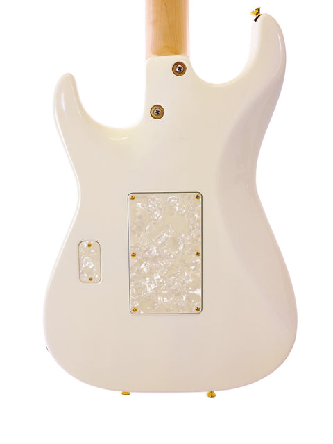 A white Tom Anderson Drop Top Classic guitar with gold and black pickguards, showcasing its elegant design from 2014.