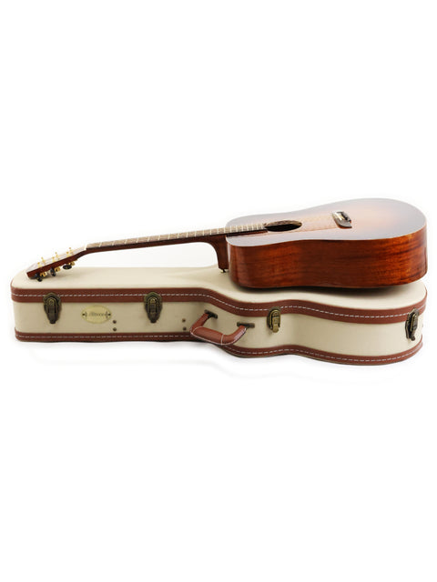 A wooden-bodied guitar case with a brown strap, highlighting the 2019 Alvarez MDA66SHB design.