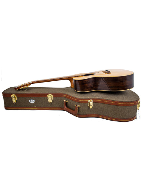 A wooden guitar case with a brown handle, marked 'Gerard Gilet 000 14 Fret Acoustic – Aust 2005'.