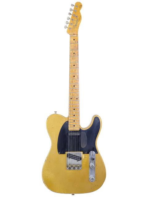 A worn yellow Fender Telecaster guitar with a maple neck on a white background.