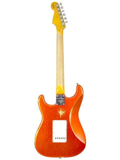 A yellow Fender Stratocaster with a white pickguard, showcasing the 2017 Ltd NAMM '64 Relic model.