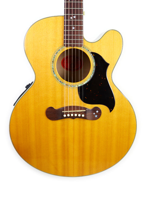 A yellow Gibson J-180EC acoustic guitar from 2001 displayed against a clean white background.
