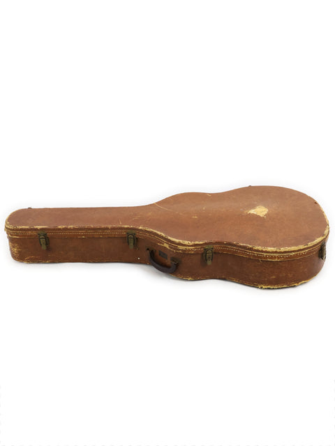 An old Gibson J-200 guitar case from 1954 displayed against a white background, highlighting its vintage charm.
