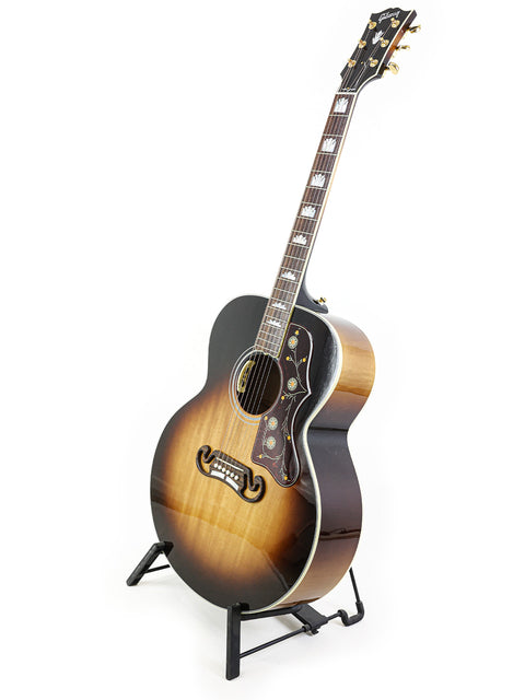 Beautiful Gibson SJ-200 guitar displayed on a stand, highlighting its craftsmanship against a bright white backdrop. Ideal for buyers.